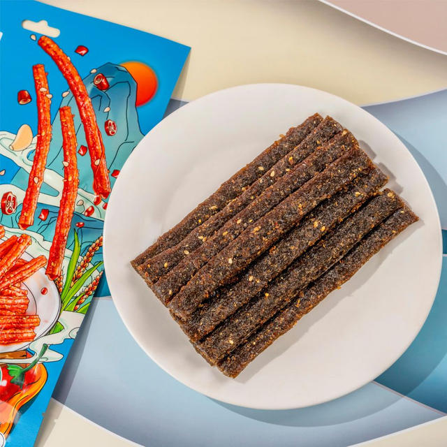 Close-up of Traditional Garlic Spicy Stick texture - chewy grain snack, Garlic Spicy flavor, vacuum-packed