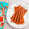Close-up of 26g Traditional Hot and Spicy Stick texture - chewy strip grain snack, Hot Spicy flavor, vacuum-packed